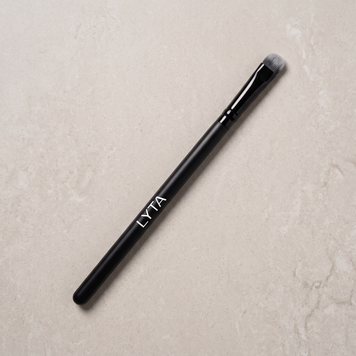 LYTA Packing Eye Brush, studio product photograph