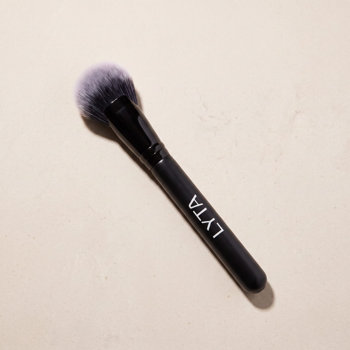 LYTA Cheek Fan Brush, studio product photograph